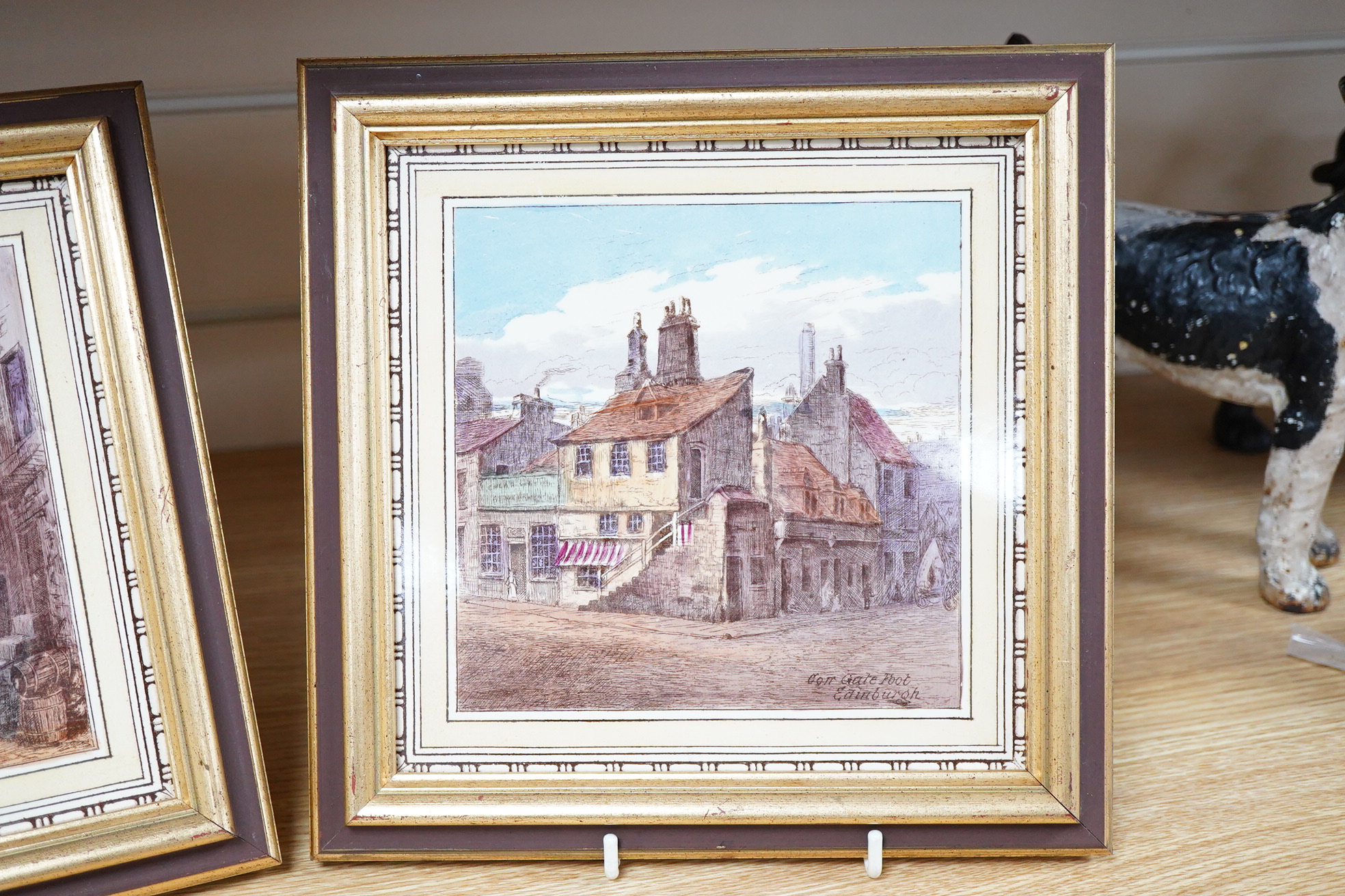 A pair of Stoke-On-Trent pottery scenic glazed tiles, 'Corner Gate Foot Edinburgh' and 'Cardinal Benton's House', framed, 19cm x 19cm